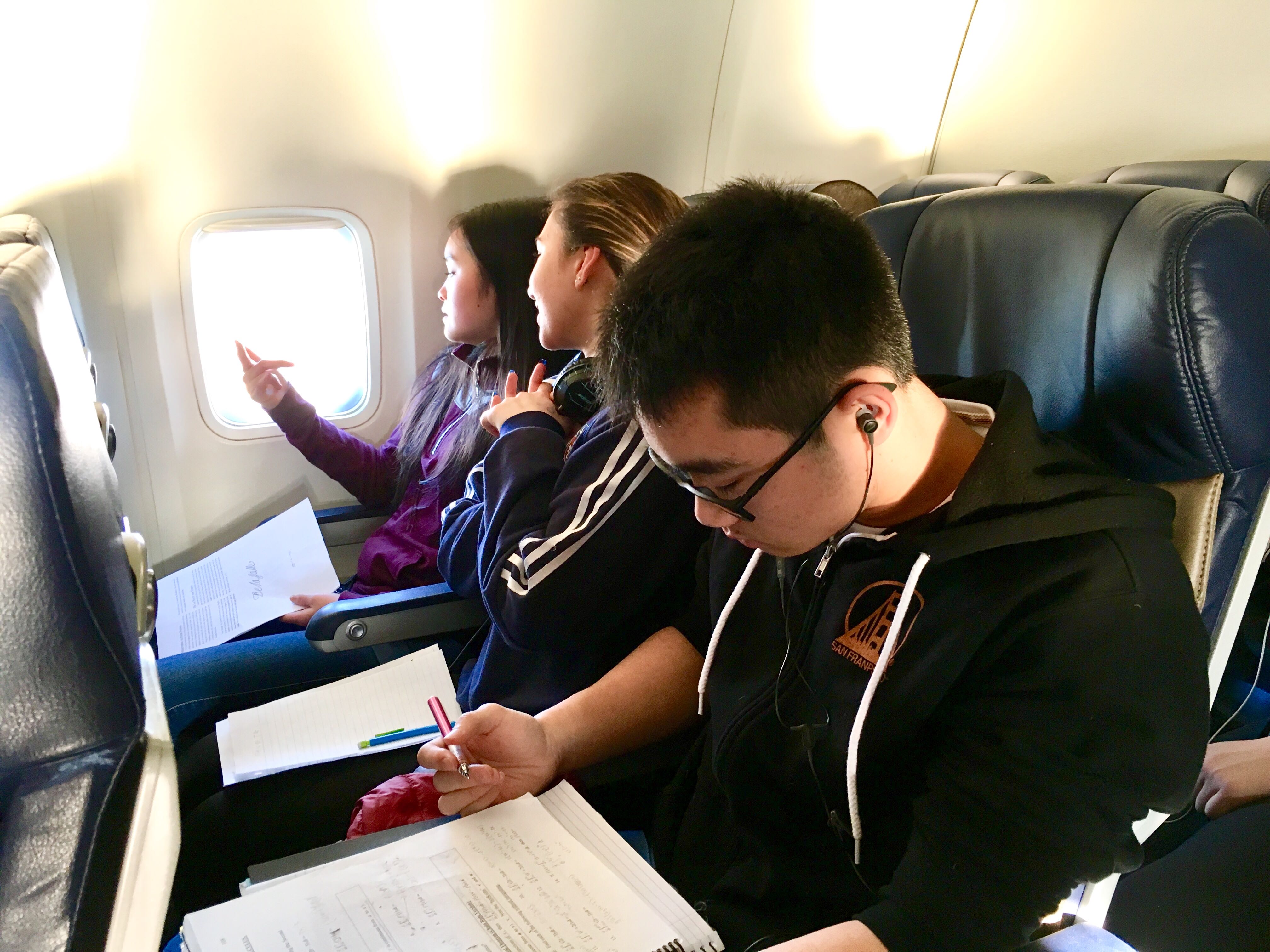 kids studying on the plane